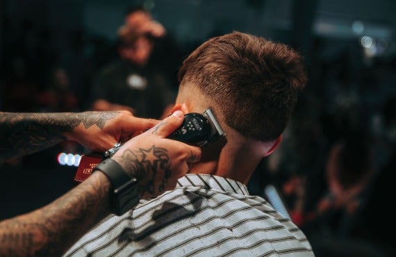 guy getting his hair trimmed